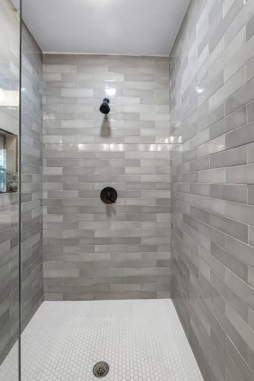 bathroom with tiled shower