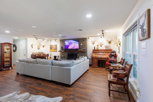 living room featuring dark hardwood / wood-style floors, ceiling fan, and crown molding