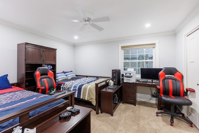 carpeted bedroom featuring ceiling fan and ornamental molding