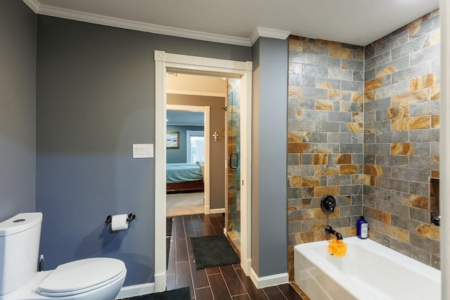 bathroom featuring shower with separate bathtub, toilet, and ornamental molding