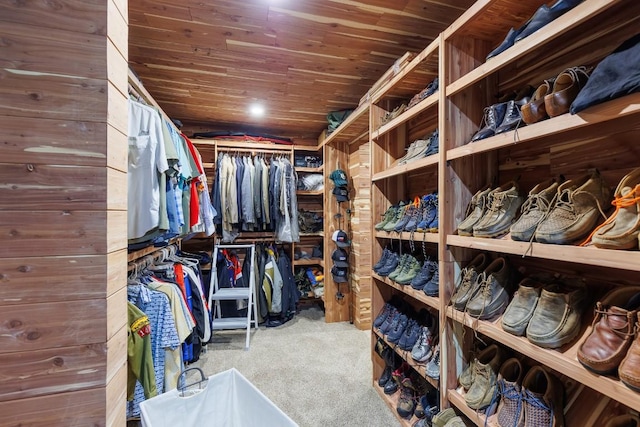 walk in closet featuring carpet floors