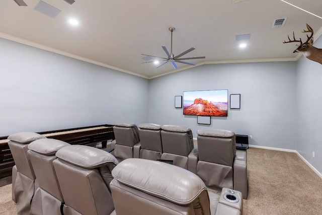 home theater with light carpet, ceiling fan, lofted ceiling, and ornamental molding