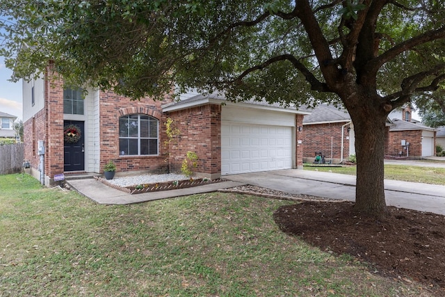 view of front of property featuring a front yard and a garage