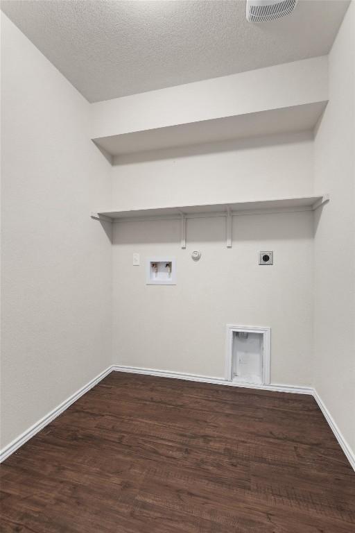 laundry room featuring hookup for an electric dryer, washer hookup, hookup for a gas dryer, and dark wood-type flooring