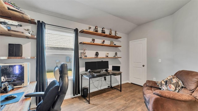 office featuring hardwood / wood-style flooring and vaulted ceiling