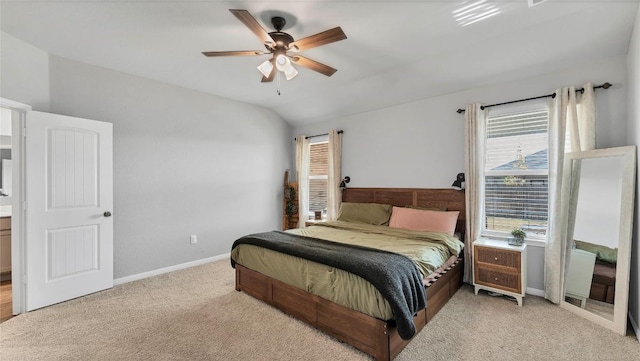 bedroom featuring vaulted ceiling, light colored carpet, and ceiling fan