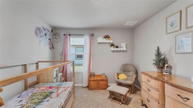 bedroom featuring light carpet