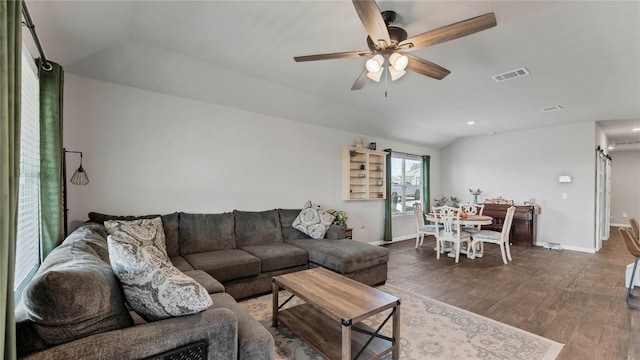 living room with hardwood / wood-style flooring, lofted ceiling, and ceiling fan