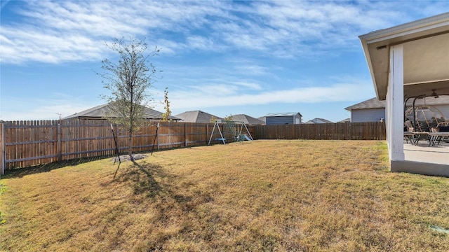 view of yard with a playground and a patio