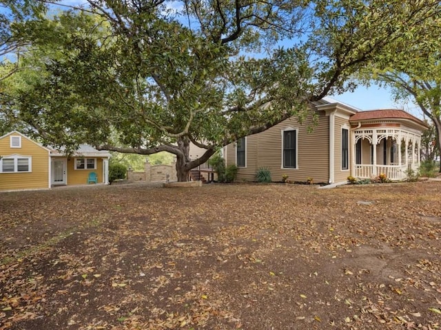 view of side of property featuring a porch