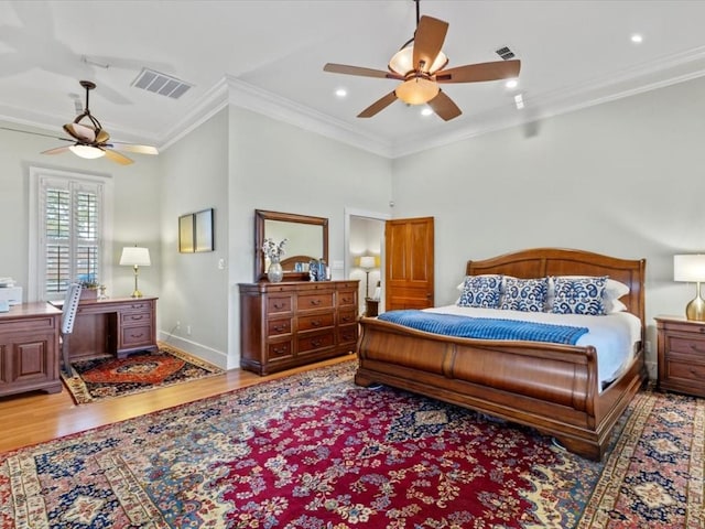 bedroom with ceiling fan, crown molding, and wood-type flooring