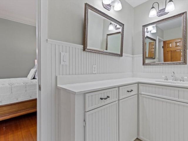 bathroom with vanity and hardwood / wood-style flooring