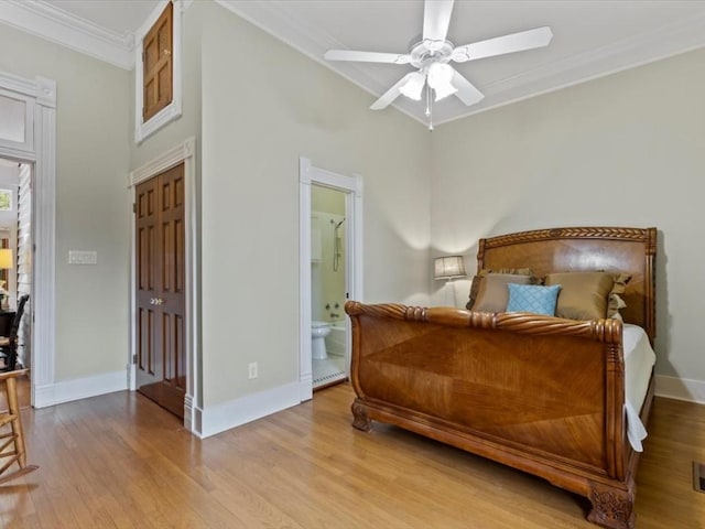 bedroom with ensuite bath, ceiling fan, crown molding, light hardwood / wood-style flooring, and a closet