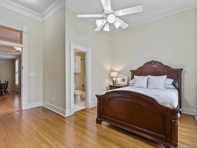 bedroom with ceiling fan, light hardwood / wood-style floors, ornamental molding, and ensuite bathroom