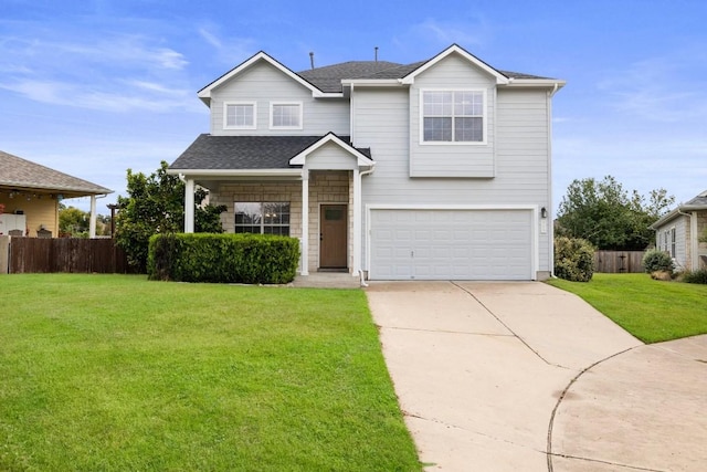 view of front of property with a garage and a front lawn