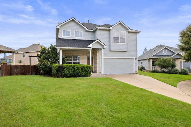 view of front of property with a front yard and a garage