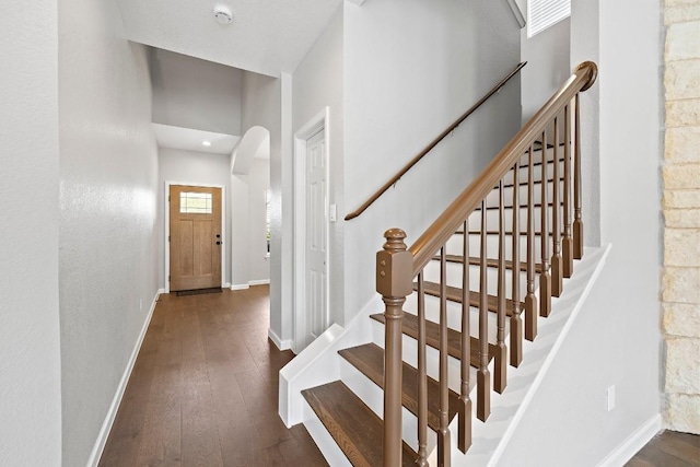 entryway with dark wood-type flooring