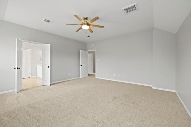 unfurnished bedroom featuring light colored carpet, ceiling fan, and lofted ceiling