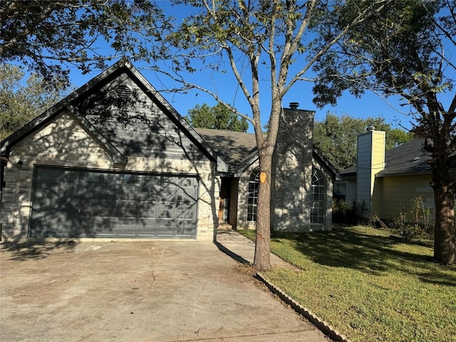 view of front facade with a front yard and a garage