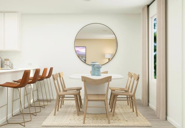 dining area featuring light wood-type flooring