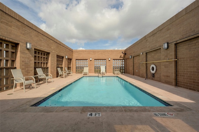 view of pool featuring a patio