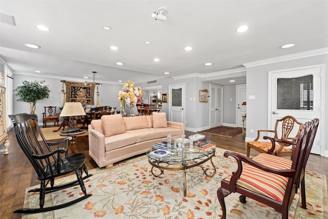 living room featuring hardwood / wood-style flooring and ornamental molding