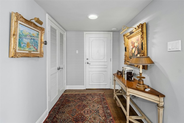 1122 Colorado St Unit 1004, Austin, TX 78701 - doorway featuring dark wood finished floors and baseboards