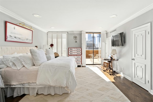 bedroom with access to exterior, hardwood / wood-style flooring, and crown molding