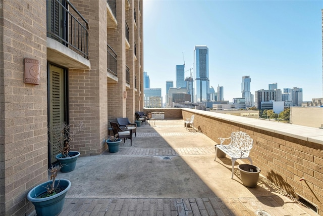 view of patio with a balcony