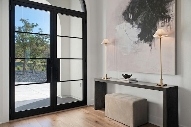 doorway featuring light hardwood / wood-style floors and french doors