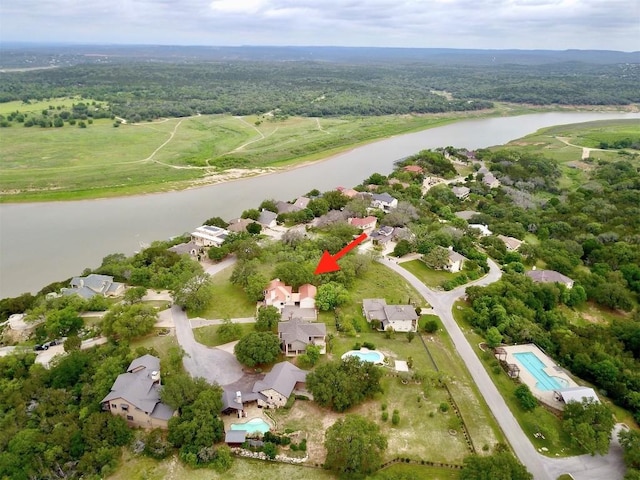 birds eye view of property featuring a water view