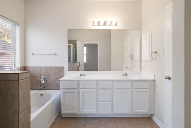 bathroom with tile patterned flooring, vanity, and separate shower and tub