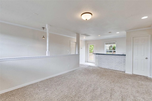 unfurnished living room featuring carpet and ornamental molding