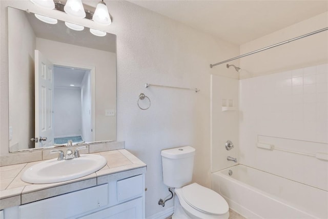 full bathroom featuring shower / bathing tub combination, vanity, and toilet