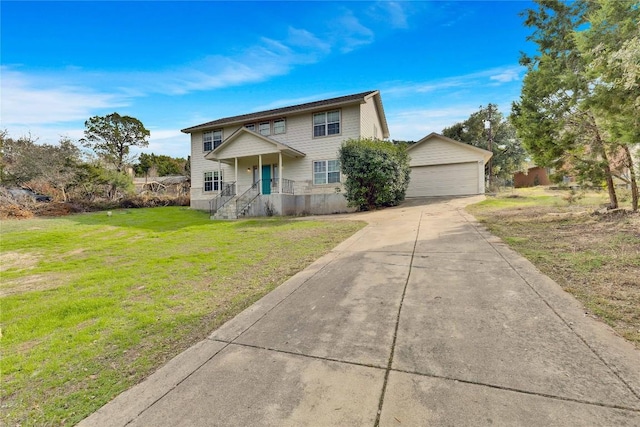 view of front facade featuring an outbuilding, a front lawn, and a garage