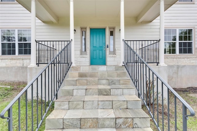 view of exterior entry with covered porch