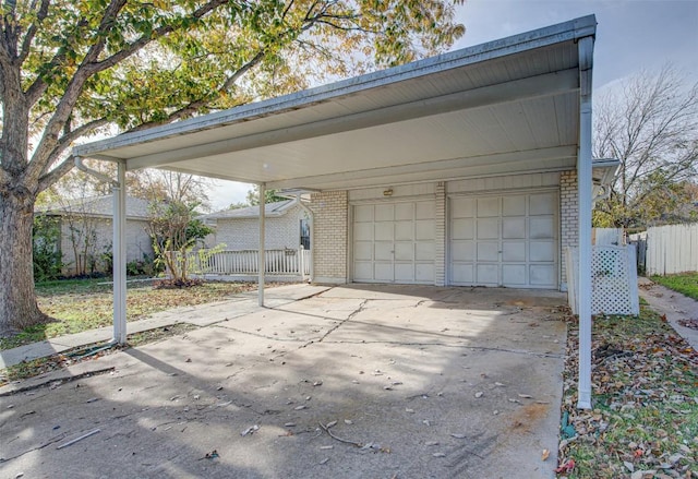 garage featuring a carport