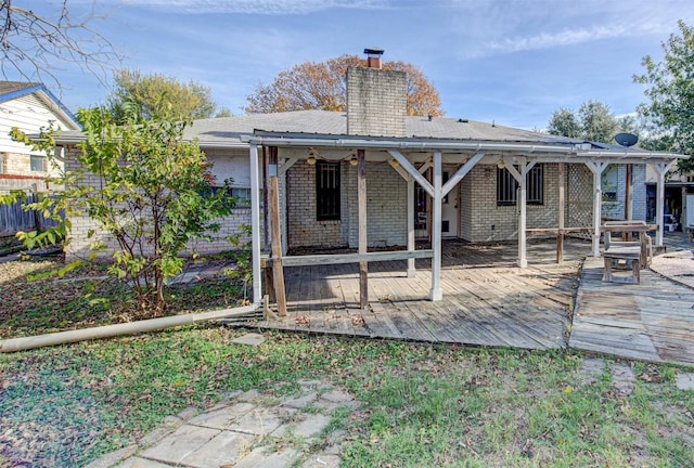 rear view of house featuring a deck