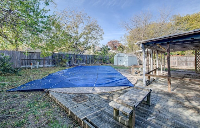 view of swimming pool with a storage unit