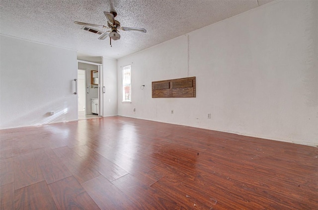 spare room featuring ceiling fan, a textured ceiling, and hardwood / wood-style flooring