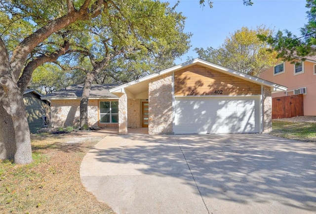 ranch-style house featuring a garage