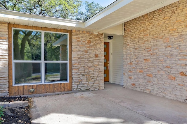 doorway to property featuring a patio area