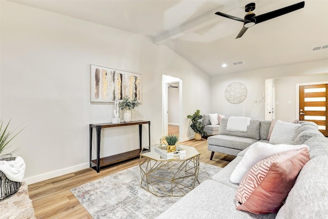 living room featuring hardwood / wood-style flooring, lofted ceiling with beams, and ceiling fan