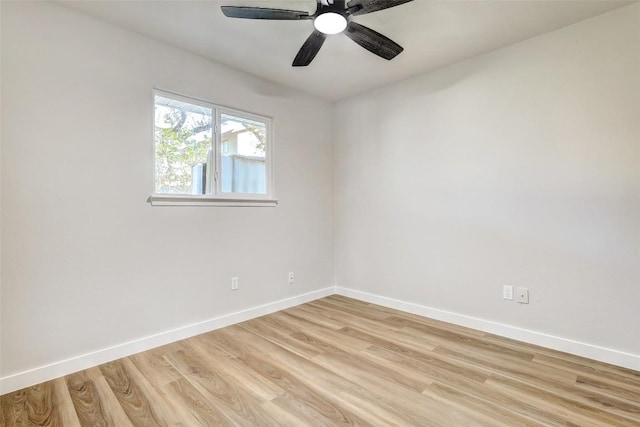 empty room with ceiling fan and light wood-type flooring