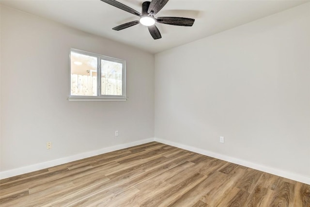 empty room featuring ceiling fan and light hardwood / wood-style flooring