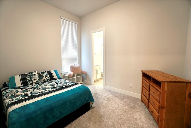 carpeted bedroom with ensuite bath