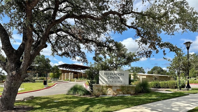 view of home's community with a lawn