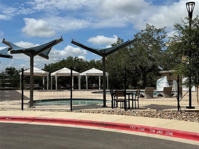 view of property's community featuring a swimming pool