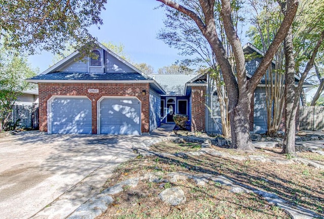 view of front of home with fence, driveway, a shingled roof, a garage, and brick siding