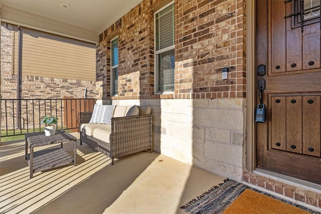 view of exterior entry featuring a porch